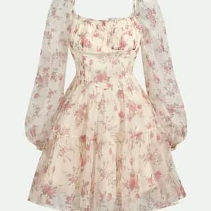 robecourtetrapezeaimprimefloralpourfilleourletvolanteetepaulesdenudees